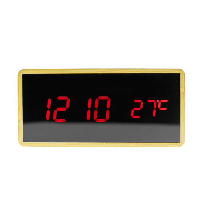 Buy Model 1299 Wooden Clock at deensquare.com Dubai | UAE. Features Bluetooth speaker, wireless charging, alarm clock, temperature &amp; humidity display.