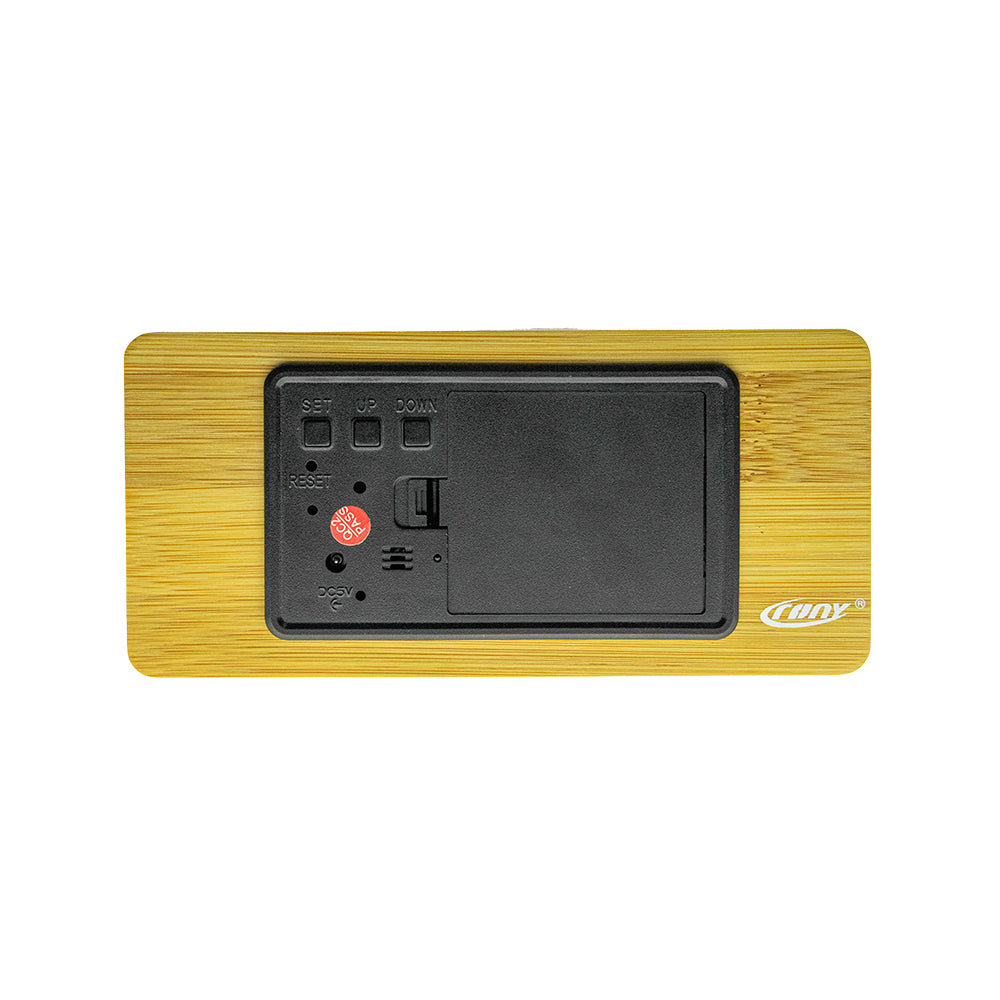 Buy Model 1299 Wooden Clock at deensquare.com Dubai | UAE. Features Bluetooth speaker, wireless charging, alarm clock, temperature &amp; humidity display.
