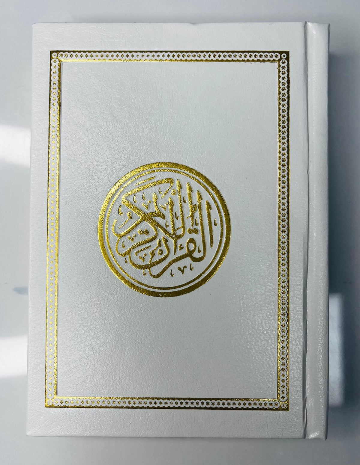 Buy 15-Line Uthmani Quran at deensquare.com | Dubai | UAE. 14×10 cm Mushaf with cream pages and white art cover for reading, study and travel.