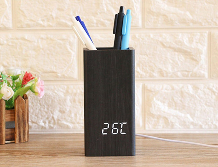 Buy Wooden Pen Holder Alarm Clock Model 2020 at deensquare.com Dubai | UAE. Features clock, calendar, temperature display &amp; desk organizer.