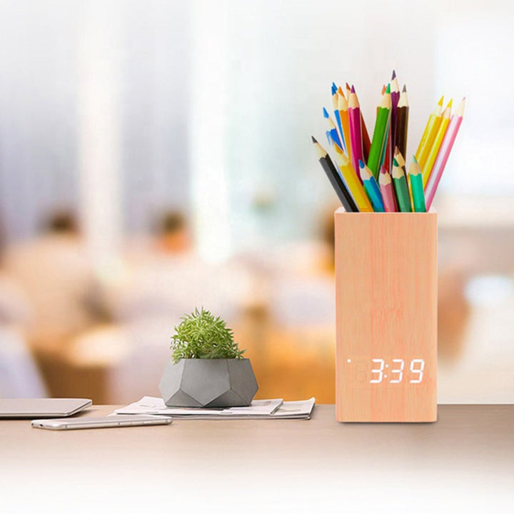 Buy Wooden Pen Holder Alarm Clock Model 2020 at deensquare.com Dubai | UAE. Features clock, calendar, temperature display &amp; desk organizer.