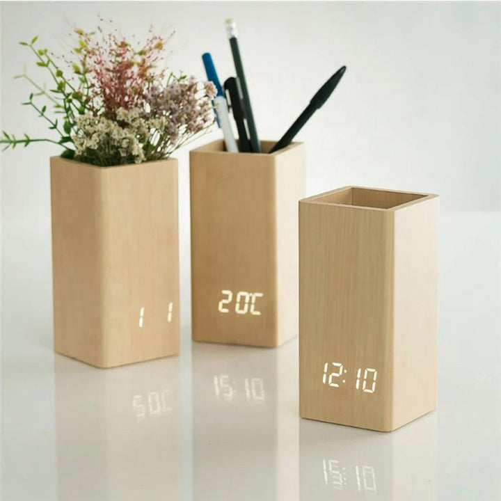 Buy Wooden Pen Holder Alarm Clock Model 2020 at deensquare.com Dubai | UAE. Features clock, calendar, temperature display &amp; desk organizer.
