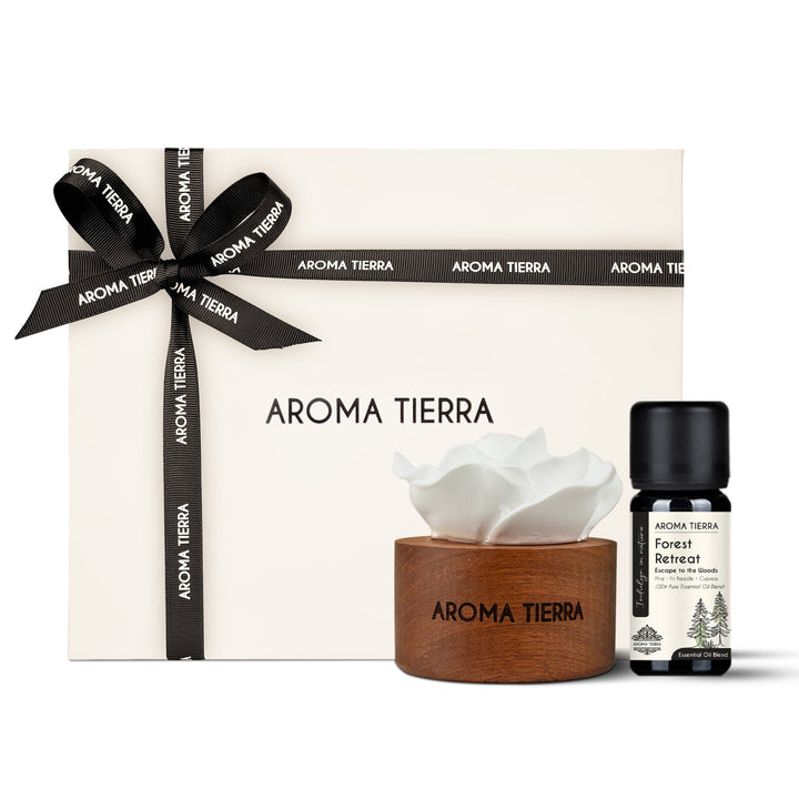 cera flora wood ceramic diffuser set with forest retreat essential oil blend in a gift box with ribbon