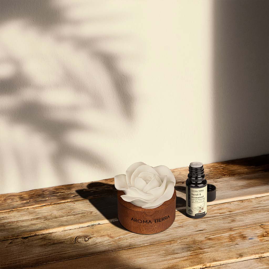 cera flora flower diffuser with neroli &amp; rosewood oil on bedside table