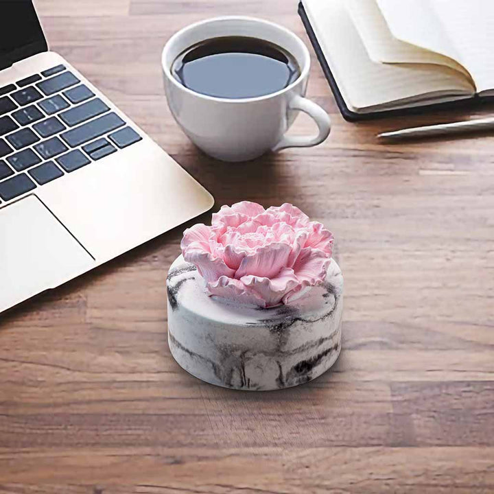 cera flora pink flower ceramic diffuser on work desk