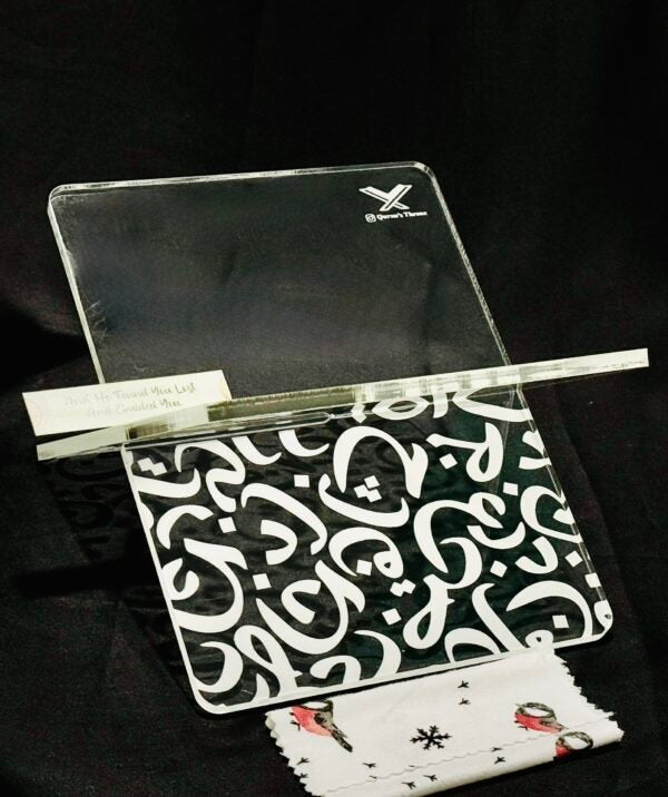 The Acrylic Quran Stand (Rehal) – Model INR is a refined and elegant Quran holder designed for durability and timeless Islamic aesthetics. Made from 8mm high-quality transparent acrylic, this Rehal features CNC-engraved Arabic alphabets, giving it a clean, premium, and long-lasting engraved finish.

Its two interlocking acrylic plates allow for easy assembly, strong support, and convenient storage. The engraved Arabic alphabet design adds a subtle yet sophisticated Islamic touch, making it ideal for daily Q