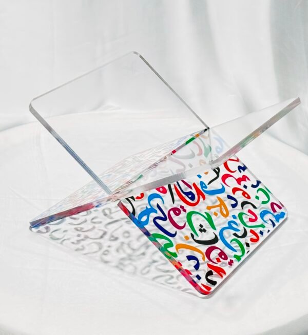 Elegant acrylic Quran stand made from 8mm acrylic with UV printed multi-color Arabic alphabets. Durable, stylish, and ideal for home, mosque, and gifting.
