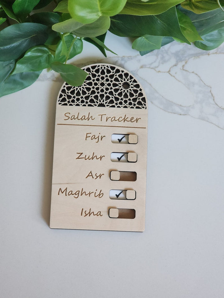 Wooden magnetic Salah tracker with toggle switches to track daily prayers. Perfect for kids and adults to build a consistent prayer habit.
