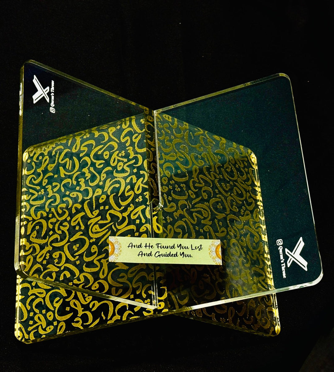 Transparent Quran stand made from 8mm acrylic with golden screen-printed Arabic design. Elegant, durable, and ideal for home, mosque, and gifts.