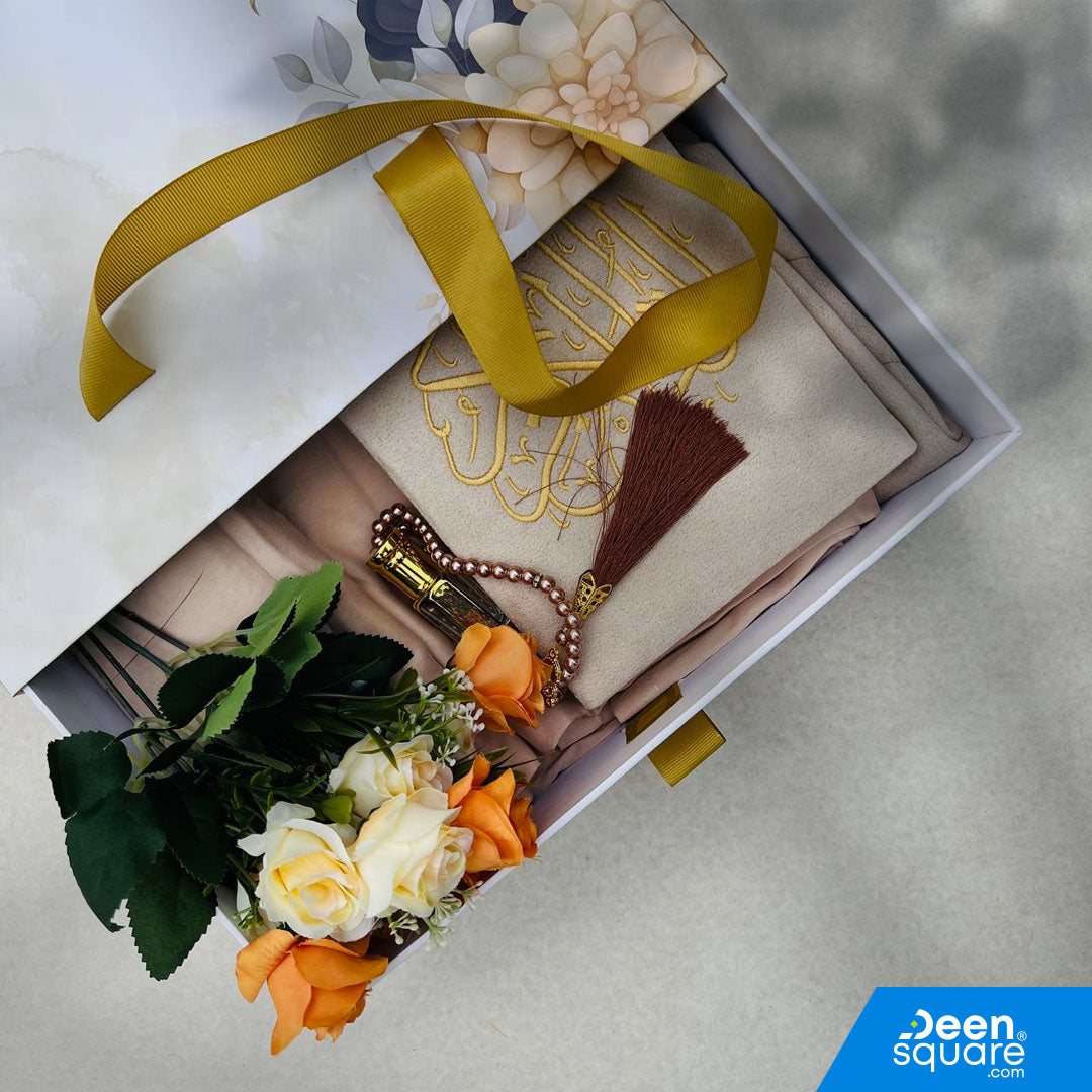 A premium Islamic gift set for women featuring a Qur’an, prayer mat, prayer dress, attar, tasbeeh, and elegant gift box. Perfect for weddings & Eid. Shipping Worldwide & across Dubai, Sharjah, Abu Dhabi, UAE