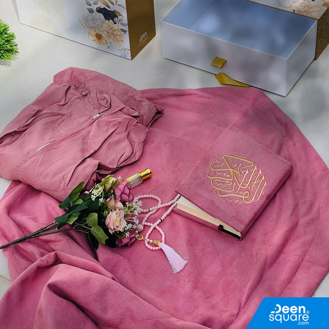 A premium Islamic gift set for women featuring a Qur’an, prayer mat, prayer dress, attar, tasbeeh, and elegant gift box. Perfect for weddings & Eid. Shipping Worldwide & across Dubai, Sharjah, Abu Dhabi, UAE